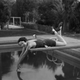 Illustration for article titled Photographers Love a Pretty Woman on a Diving Board